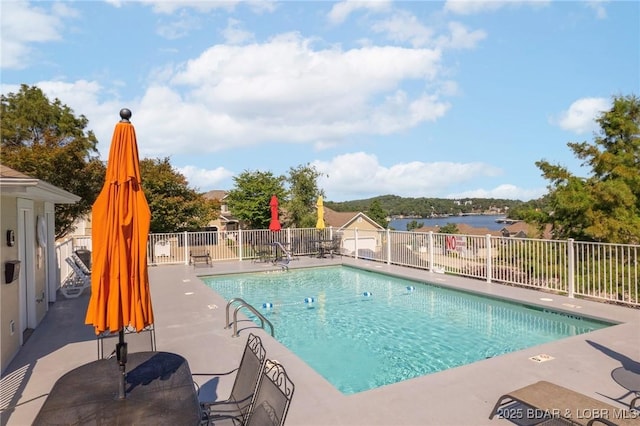 view of swimming pool with a patio