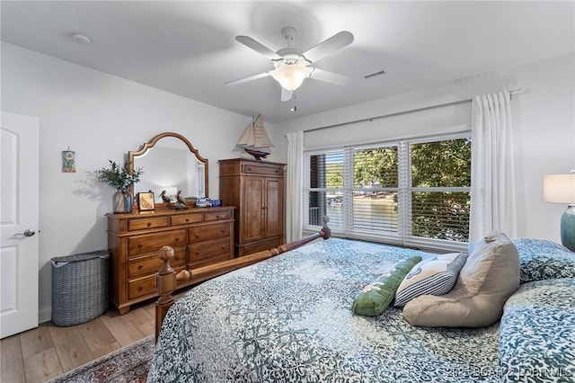 bedroom with wood-type flooring and ceiling fan