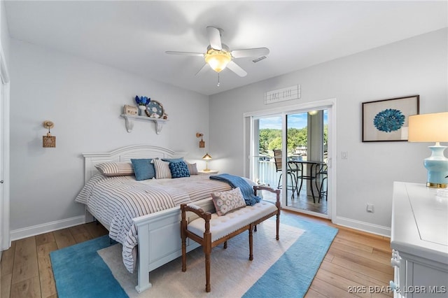 bedroom featuring access to exterior, light hardwood / wood-style floors, and ceiling fan