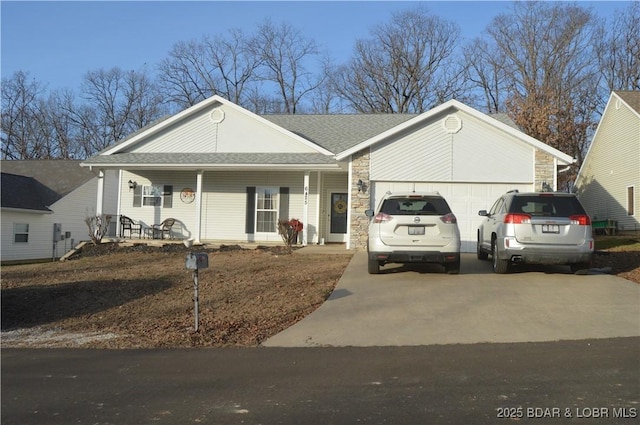 ranch-style house with a garage and covered porch