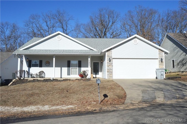 ranch-style home featuring a garage and covered porch