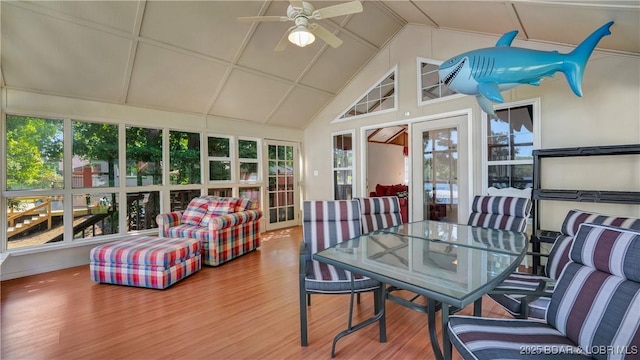 sunroom featuring ceiling fan and vaulted ceiling