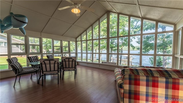 sunroom / solarium with ceiling fan and lofted ceiling