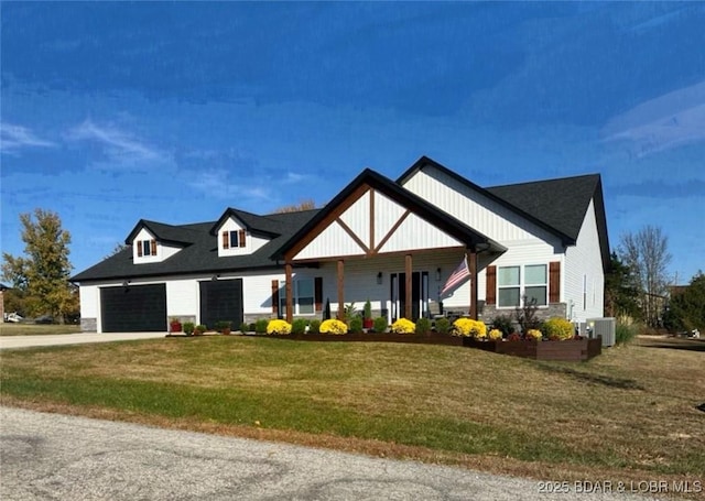 view of front of house featuring a porch, central AC unit, and a front yard