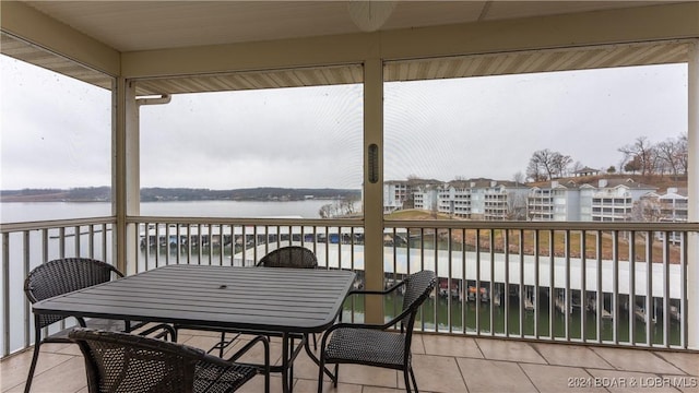 sunroom / solarium with a water view