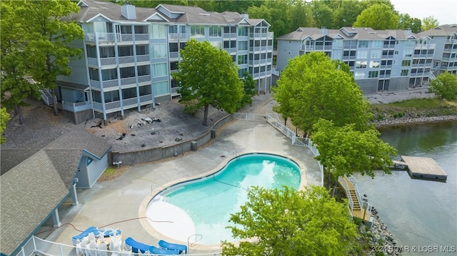 view of swimming pool with a water view