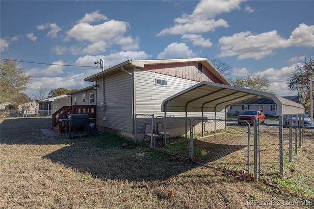 view of side of home with a carport