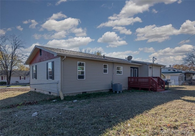 rear view of house with a wooden deck and central AC unit