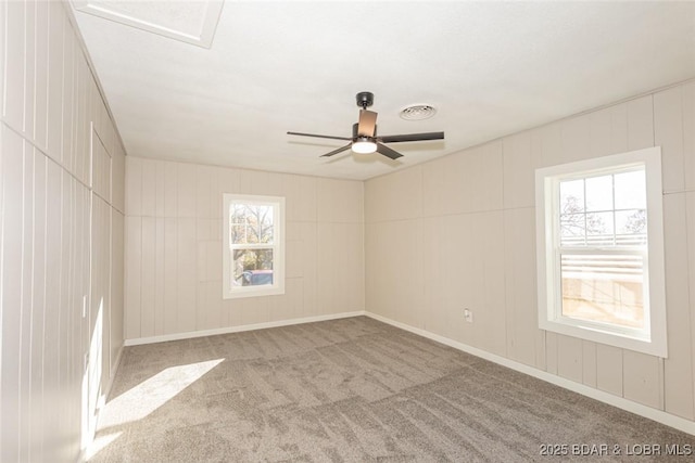 unfurnished room with light carpet and ceiling fan