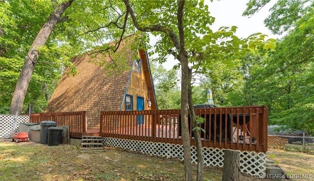 rear view of house with a deck