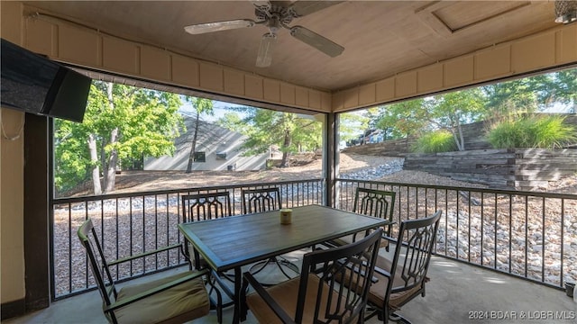 sunroom / solarium with ceiling fan