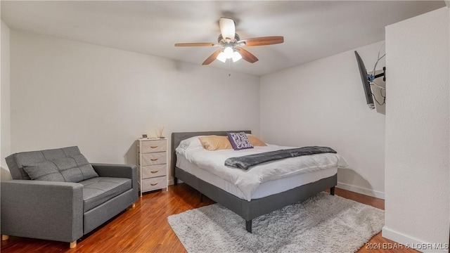 bedroom featuring wood-type flooring and ceiling fan