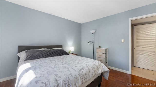 bedroom featuring dark wood-type flooring