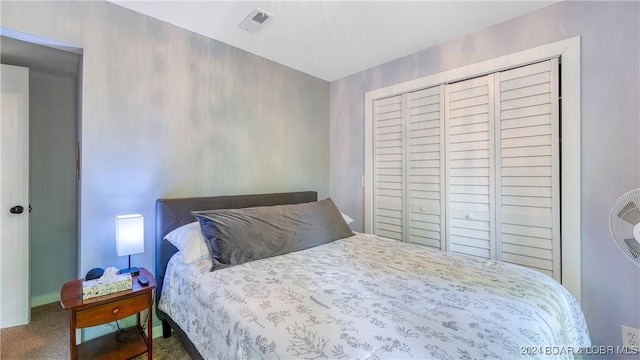 bedroom with carpet floors and a closet