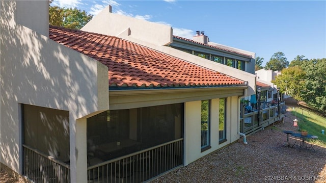 exterior space featuring a sunroom