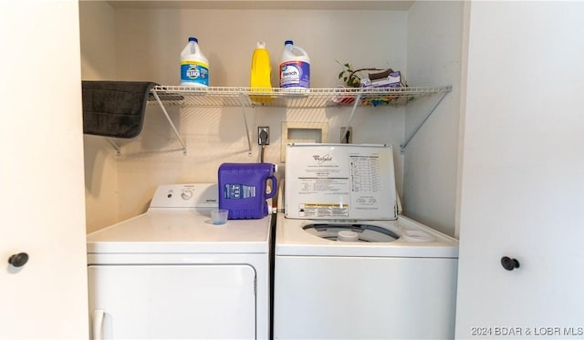 washroom with washing machine and dryer