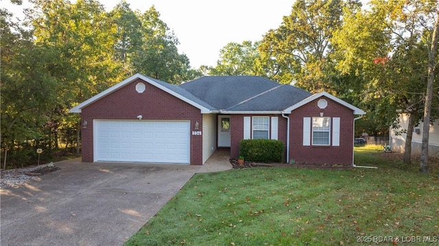 single story home with a garage and a front lawn