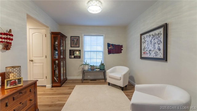 sitting room with light hardwood / wood-style flooring