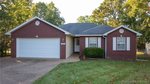 single story home with a front lawn and a garage