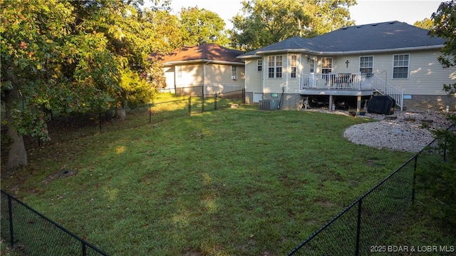 view of yard with a deck and central AC unit