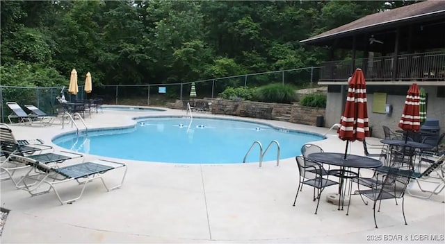 view of swimming pool with a patio area