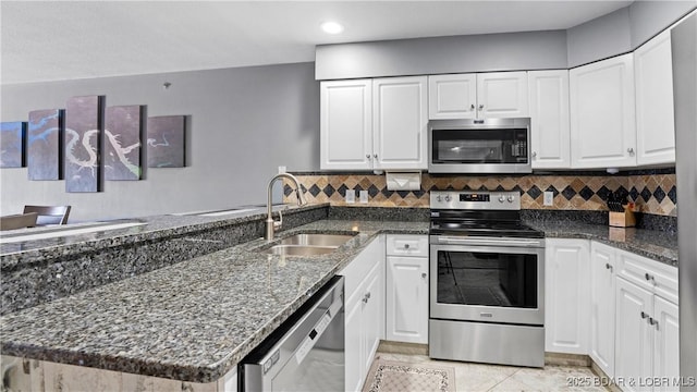 kitchen featuring sink, white cabinetry, and appliances with stainless steel finishes