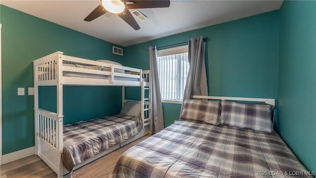 bedroom with ceiling fan and hardwood / wood-style floors