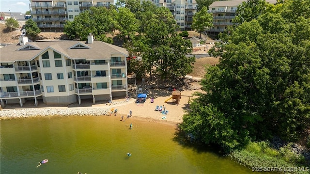 birds eye view of property with a water view