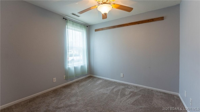 carpeted empty room featuring ceiling fan