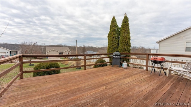 wooden terrace featuring grilling area