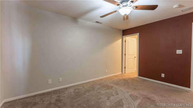 unfurnished room with ceiling fan and light colored carpet