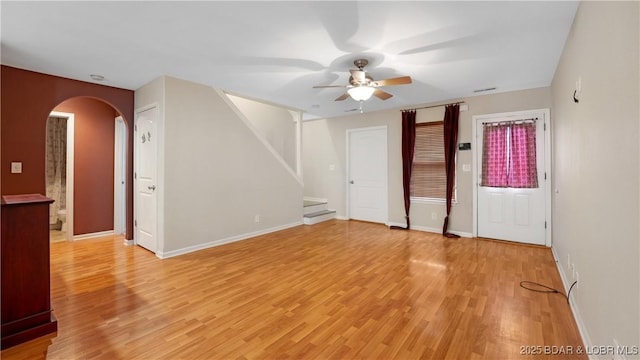 empty room with light hardwood / wood-style flooring and ceiling fan