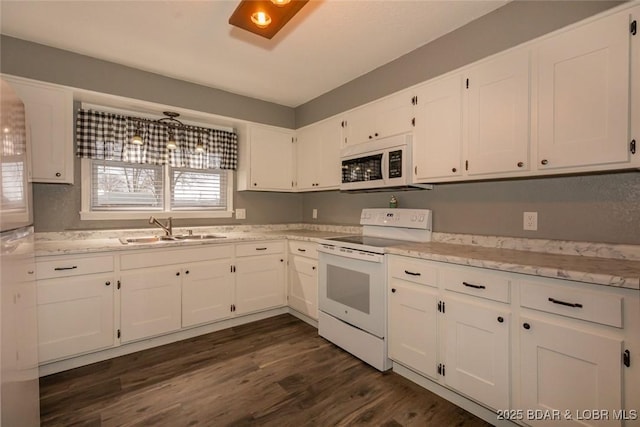 kitchen featuring sink, white cabinets, dark hardwood / wood-style floors, and white appliances