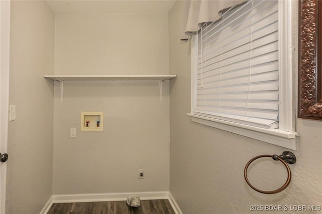 laundry room with hookup for an electric dryer, hookup for a washing machine, and dark hardwood / wood-style floors