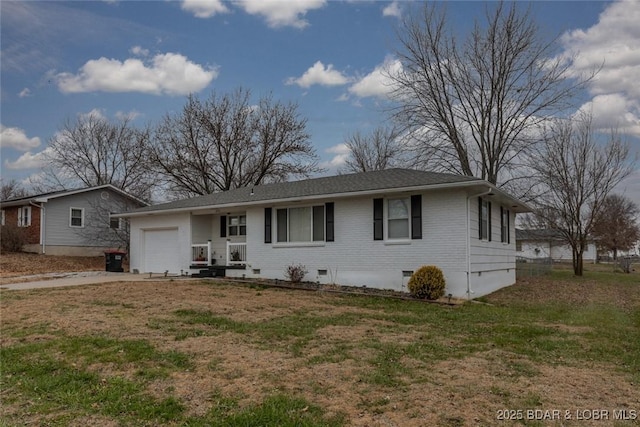 view of front of house with a front yard and a garage