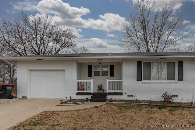 single story home featuring a porch and a garage