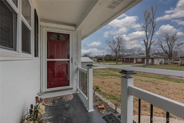 entrance to property with covered porch