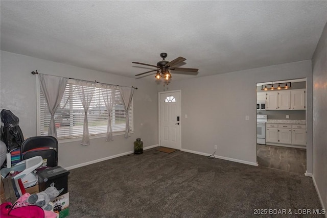 interior space featuring ceiling fan and a textured ceiling