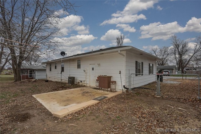 back of house featuring central AC and a patio area