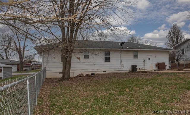 back of house with a yard, a patio, and central AC unit