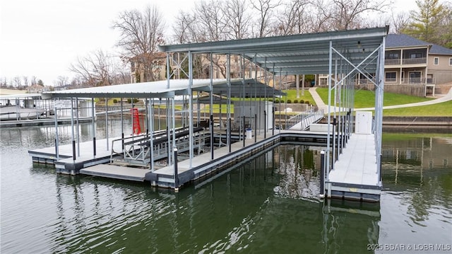 dock area featuring a water view and a yard