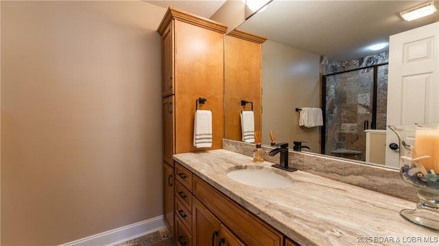 bathroom with vanity and an enclosed shower