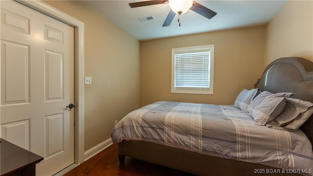 bedroom featuring dark hardwood / wood-style floors and ceiling fan