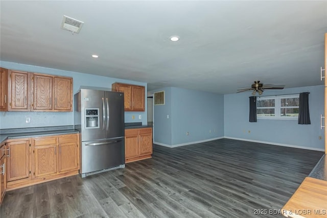 kitchen with ceiling fan, dark hardwood / wood-style flooring, and stainless steel refrigerator with ice dispenser