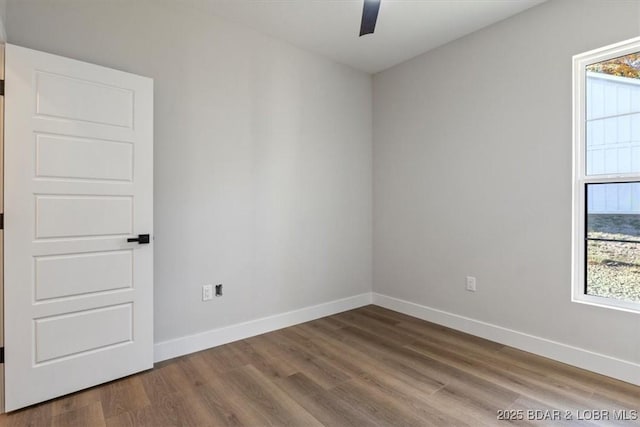 unfurnished room with hardwood / wood-style floors