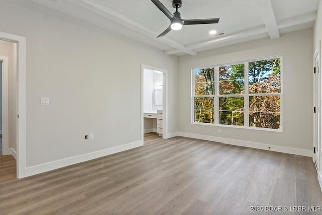 unfurnished bedroom with ensuite bathroom, coffered ceiling, ceiling fan, light hardwood / wood-style flooring, and beamed ceiling