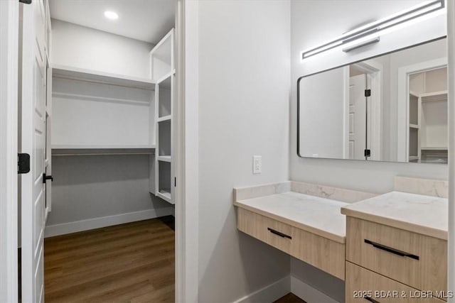 bathroom featuring hardwood / wood-style floors and vanity