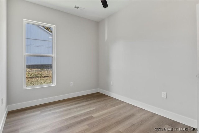 unfurnished room with ceiling fan and light hardwood / wood-style flooring