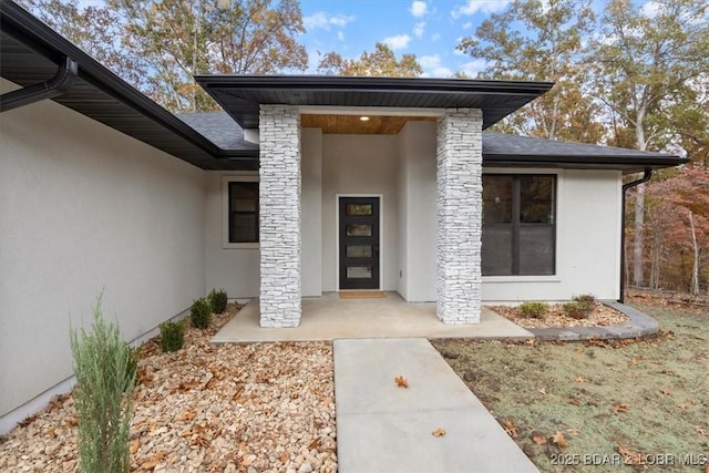 property entrance with a patio