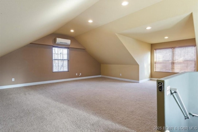 additional living space featuring light colored carpet, a wall mounted AC, and lofted ceiling